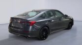 Dark gray modern sedan angled rear three-quarter view