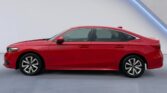 Red sedan side profile on gray backdrop
