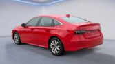 Red Honda Civic sedan rear three-quarter view