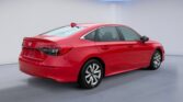 Red Honda sedan in bright showroom