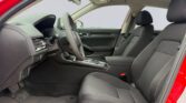Red sedan front interior with cloth seats