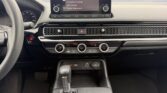 Car dashboard with touchscreen and gear shifter