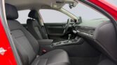 Red car interior with dashboard and black seats