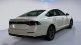White Honda sedan rear three-quarter view