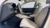Beige front car interior with steering wheel