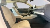 Beige front seats and modern car dashboard