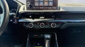 Car dashboard with touchscreen and gear shifter