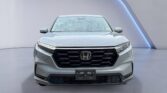 Silver Honda SUV front view in studio