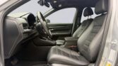 Car front interior with steering wheel, leather seats