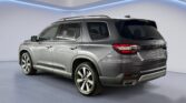 Gray SUV rear three-quarter studio shot