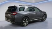 Gray midsize SUV rear three-quarter view