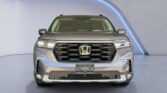 Front view of gray Honda SUV in studio