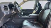 Black leather car interior with front seats