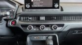 Car dashboard with infotainment and climate controls
