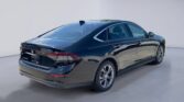 Black modern sedan parked in showroom