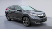 Gray Honda CR-V compact SUV in showroom